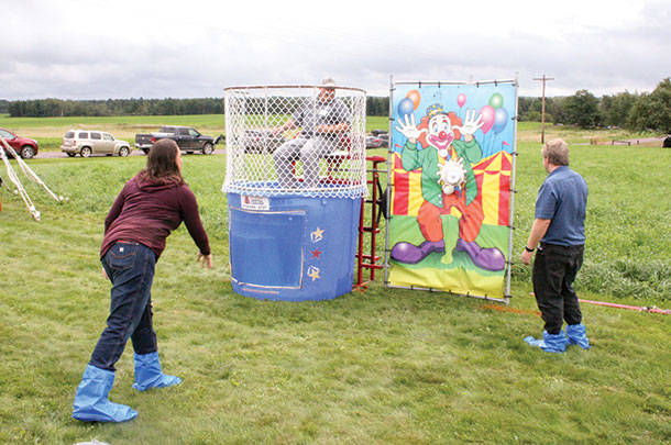 Vita Plus employees and owners took turns in the dunk tank
