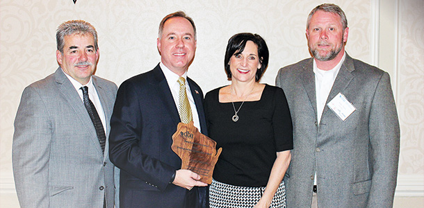 Robin Vos receiving the Dairy Business Association Leadership Award