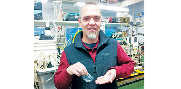 Erik Coats with raw PHA plastic samples