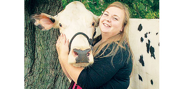Kelli woodring with a cow