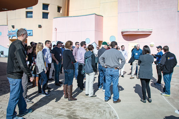 Producers learn about SeaWorld's yourht education efforts whlie standing in the courtyard of the education center