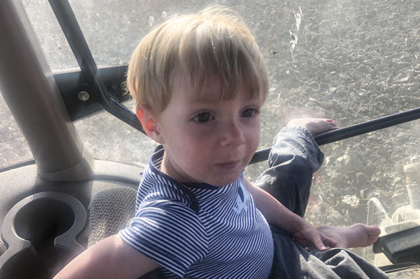 Grandson Henry Warren got a tractor ride with Opa