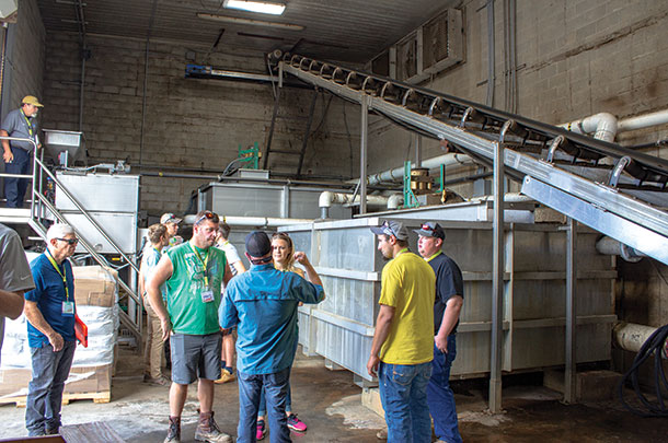 In this building at Windy Ridge Dairy, large manure fibers move up the conveyor to a storage area, while the effluent from rotary screen separators is mixed with a polymer before being transferred to DAF tanks in a second building.