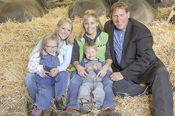Mary and Eric Topp are pictured with their children